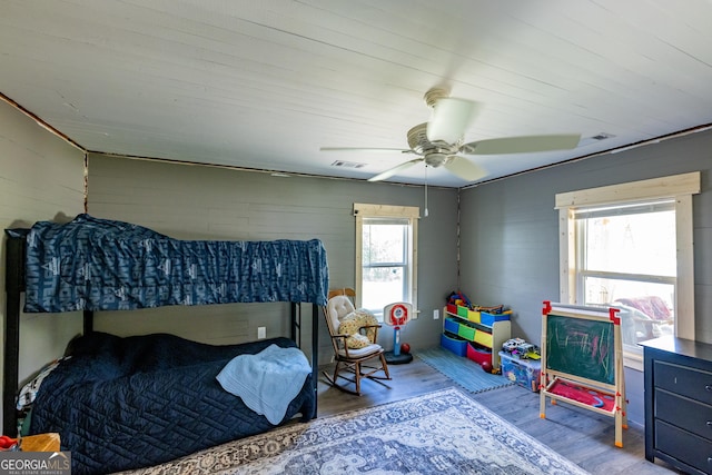 bedroom with wood finished floors and a ceiling fan