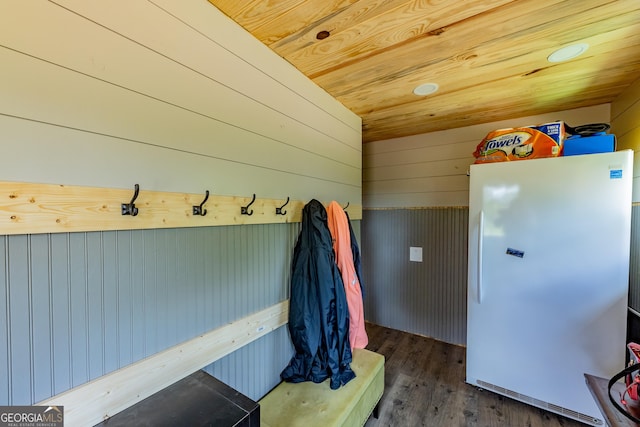 mudroom featuring wood finished floors, wood walls, and wooden ceiling