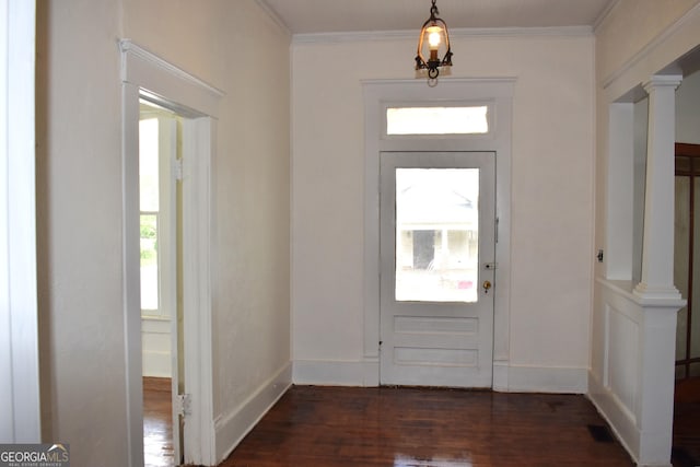 210 E Church St, Sandersville, GA 31082 - entryway featuring plenty of natural light, dark wood-style flooring, ornamental molding, ornate columns, and baseboards