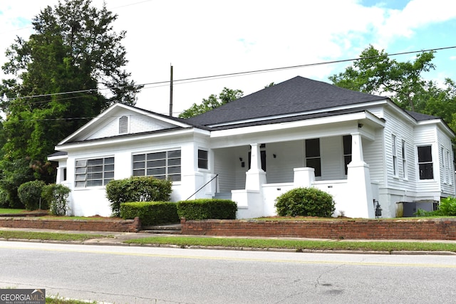 210 E Church St, Sandersville, GA 31082 - view of front facade with covered porch and a shingled roof