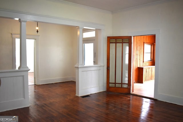 210 E Church St, Sandersville, GA 31082 - foyer with ornate columns, crown molding, wood finished floors, and baseboards