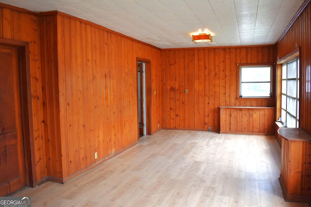 210 E Church St, Sandersville, GA 31082 - empty room with light wood finished floors and wood walls
