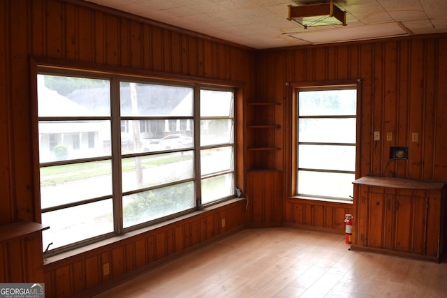 210 E Church St, Sandersville, GA 31082 - unfurnished room featuring wood walls and light wood-style floors