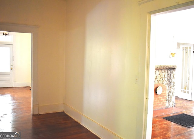 210 E Church St, Sandersville, GA 31082 - hall featuring dark wood-style floors and baseboards