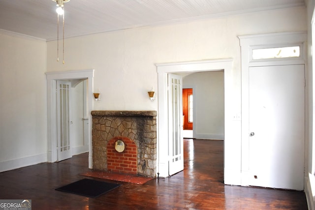 210 E Church St, Sandersville, GA 31082 - unfurnished living room with crown molding, wood finished floors, a fireplace, and baseboards
