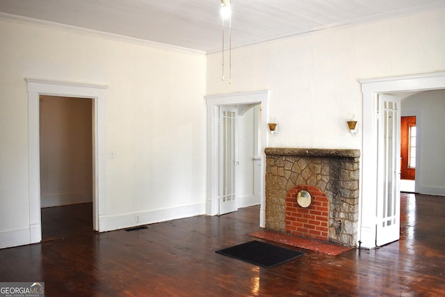 210 E Church St, Sandersville, GA 31082 - unfurnished living room featuring wood finished floors, baseboards, crown molding, and a fireplace