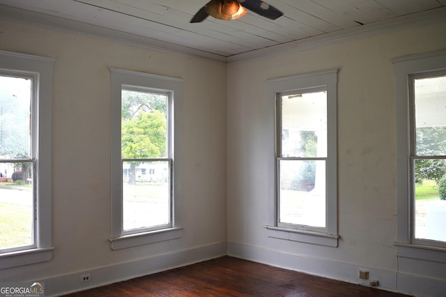 210 E Church St, Sandersville, GA 31082 - unfurnished room featuring crown molding, dark wood-style floors, a ceiling fan, and baseboards