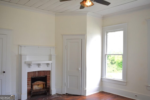 210 E Church St, Sandersville, GA 31082 - living area featuring a ceiling fan, healthy amount of natural light, crown molding, dark wood-type flooring, and a wood stove