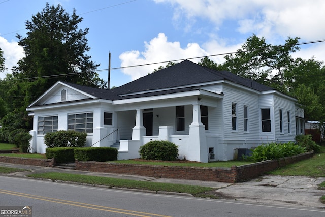210 E Church St, Sandersville, GA 31082 - view of front of home featuring covered porch and a shingled roof