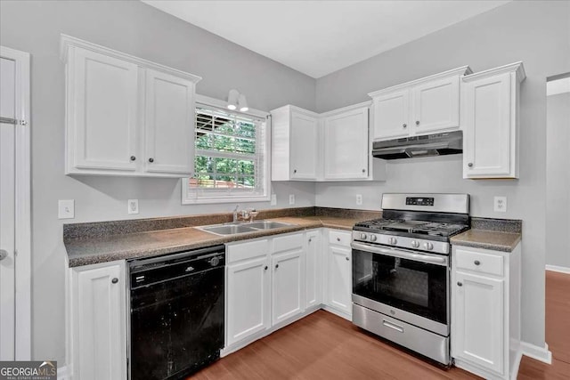 kitchen with stainless steel gas stove, dishwasher, under cabinet range hood, and wood finished floors