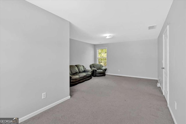 living area with carpet floors and baseboards