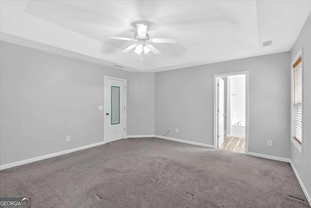 unfurnished room with carpet, baseboards, and a ceiling fan