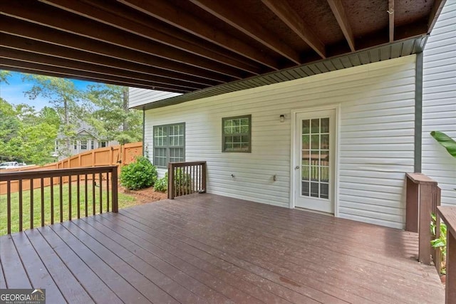 wooden terrace featuring fence