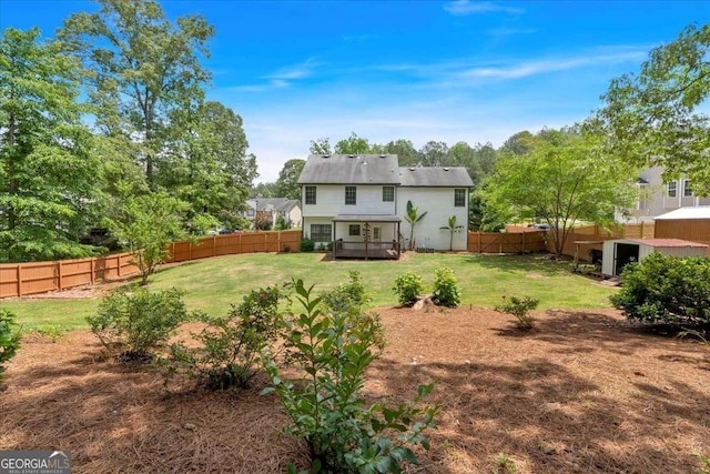 rear view of property featuring a deck