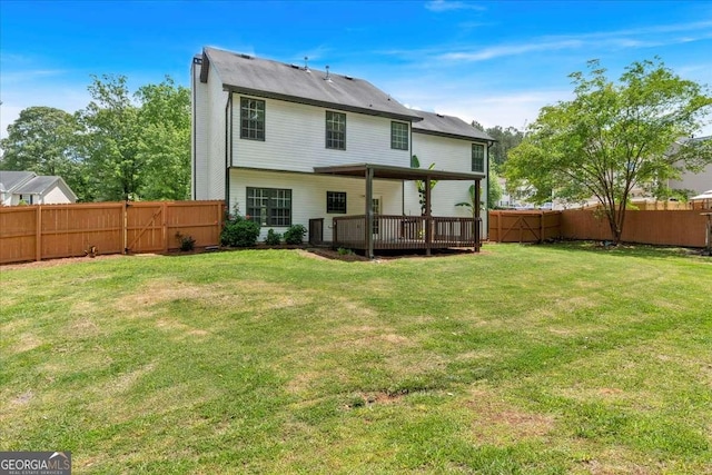 back of property featuring a wooden deck
