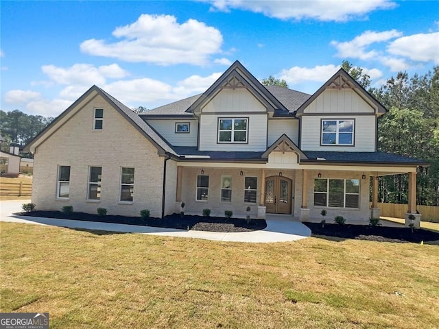 1461 Leach Dr, Lawrenceville, GA 30045 - view of front of house featuring french doors, a porch, board and batten siding, and brick siding