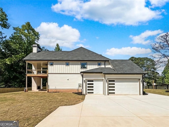1461 Leach Dr, Lawrenceville, GA 30045 - view of side of home with a balcony, a garage, driveway, a chimney, and a shingled roof