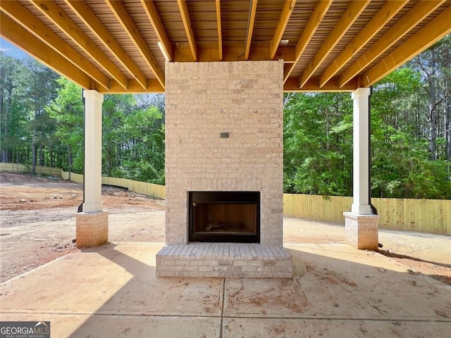 1461 Leach Dr, Lawrenceville, GA 30045 - view of patio featuring an outdoor brick fireplace and view of scattered trees