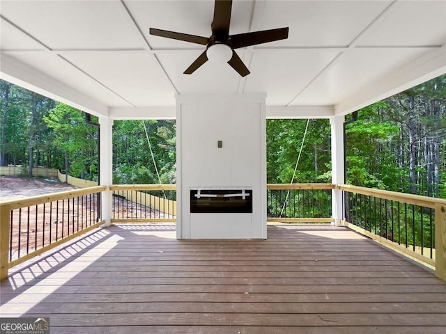 1461 Leach Dr, Lawrenceville, GA 30045 - wooden deck featuring a ceiling fan and view of scattered trees