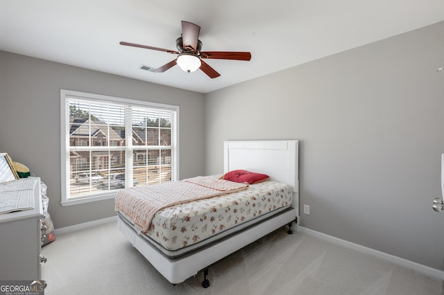 2430 Redbud Meadow Ln, Douglasville, GA 30135 - bedroom featuring light carpet, baseboards, and a ceiling fan
