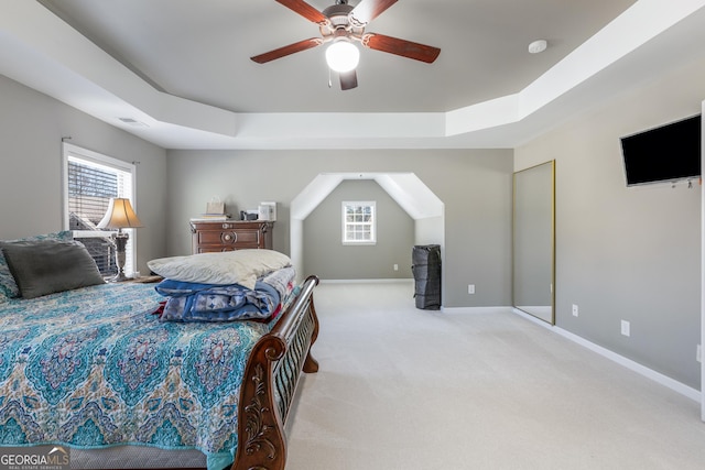 2430 Redbud Meadow Ln, Douglasville, GA 30135 - bedroom featuring multiple windows, carpet floors, a raised ceiling, and baseboards