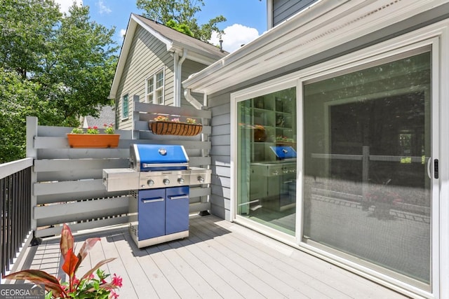 wooden terrace with area for grilling