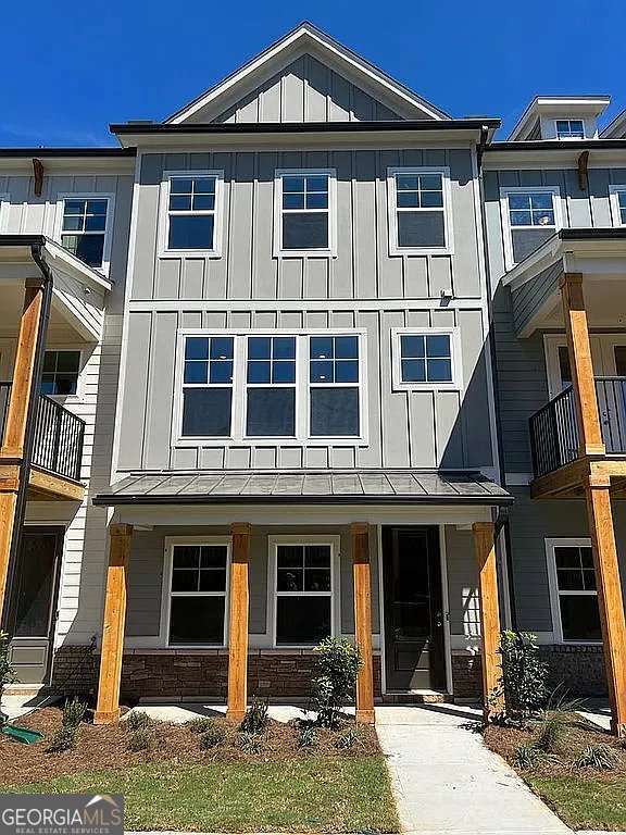 1616 Avery Way, Tucker, GA 30084 - multi unit property featuring board and batten siding, a standing seam roof, and metal roof