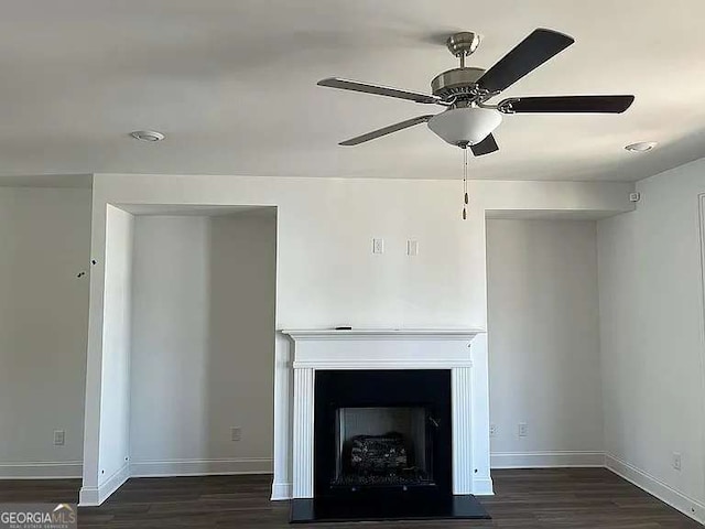 1616 Avery Way, Tucker, GA 30084 - detailed view of a fireplace, wood finished floors, baseboards, and ceiling fan