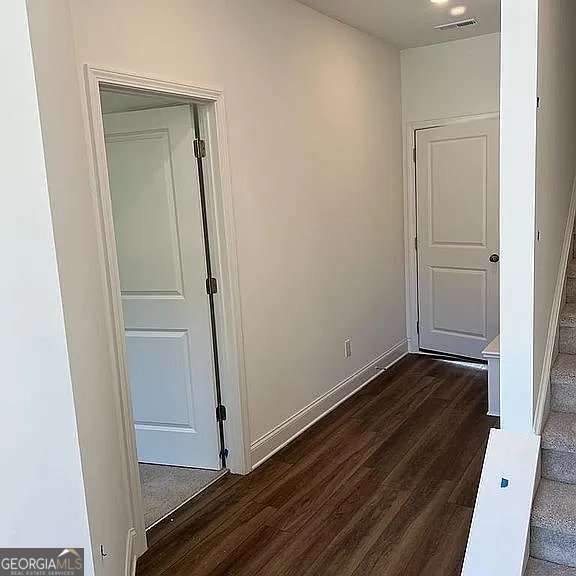 1616 Avery Way, Tucker, GA 30084 - unfurnished bedroom featuring dark wood-type flooring and baseboards