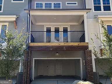 1616 Avery Way, Tucker, GA 30084 - doorway to property featuring a balcony, an attached garage, and concrete driveway