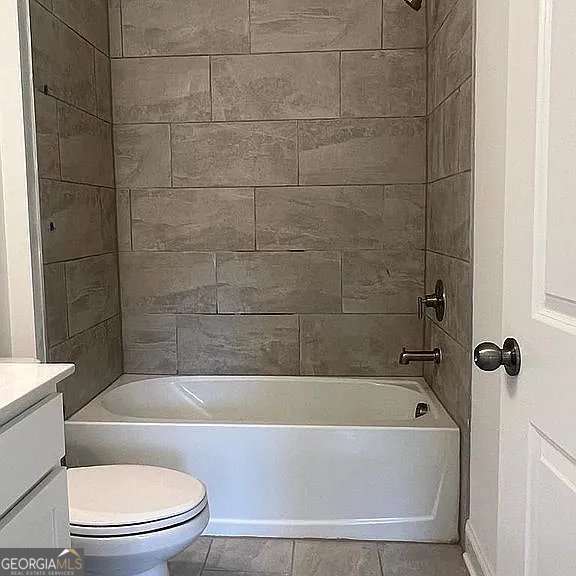 1616 Avery Way, Tucker, GA 30084 - full bathroom featuring vanity, toilet, shower / bathtub combination, and tile patterned floors