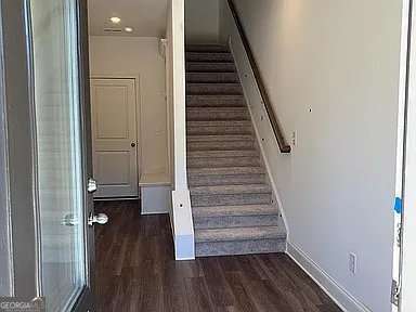 1616 Avery Way, Tucker, GA 30084 - stairway featuring wood finished floors and baseboards