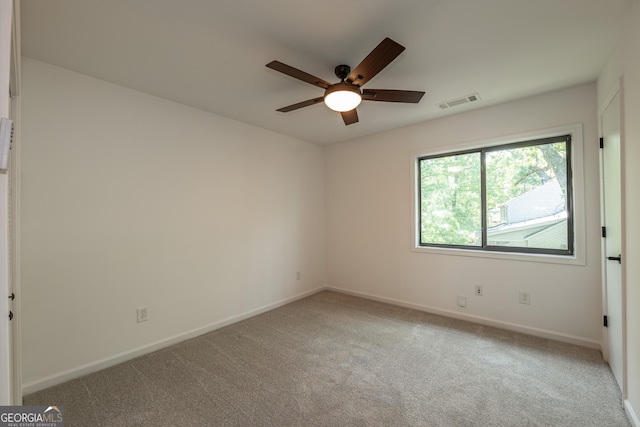 unfurnished room featuring ceiling fan, baseboards, and carpet floors