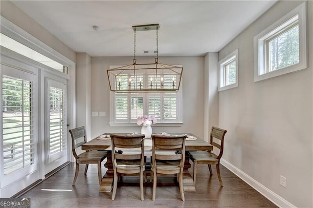 dining space featuring baseboards