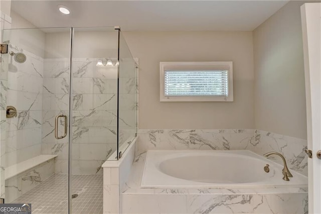 full bath featuring a bath and a stall shower