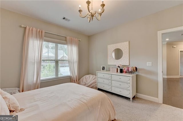 carpeted bedroom featuring a chandelier and baseboards