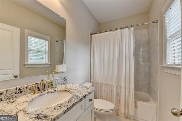bathroom featuring toilet, vanity, and shower / bath combo with shower curtain