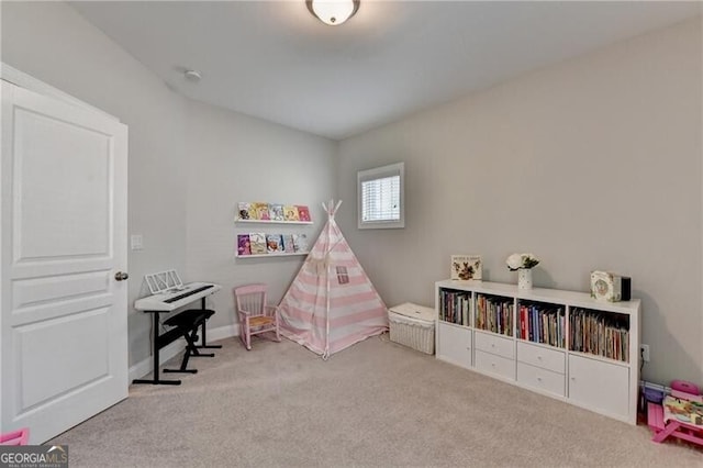 game room with carpet floors and baseboards