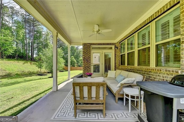 sunroom / solarium with a ceiling fan and outdoor lounge area