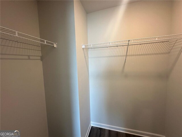 8668 Webb Rd Unit 6, Riverdale, GA 30274 - walk in closet featuring dark wood-style floors