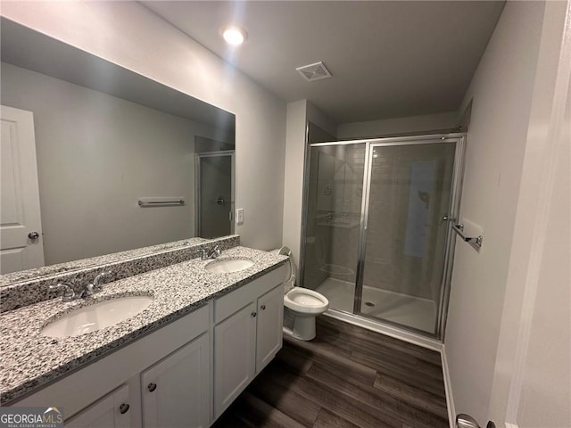 8668 Webb Rd Unit 6, Riverdale, GA 30274 - bathroom featuring a stall shower, wood finished floors, toilet, and double vanity