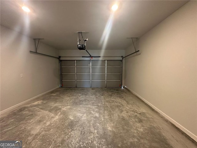 8668 Webb Rd Unit 6, Riverdale, GA 30274 - garage featuring a garage door opener and baseboards