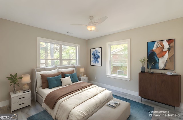 3275 Dodson Dr, East Point, GA 30344 - bedroom with multiple windows, baseboards, light wood-style flooring, and a ceiling fan