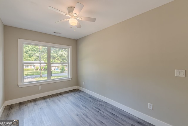 3275 Dodson Dr, East Point, GA 30344 - empty room with wood finished floors, baseboards, and ceiling fan