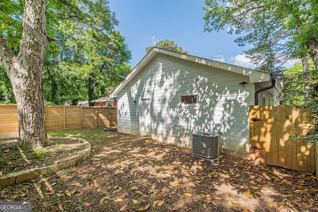 3275 Dodson Dr, East Point, GA 30344 - view of home's exterior featuring a fenced backyard and central air condition unit