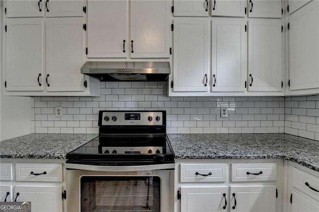 kitchen with stainless steel electric range oven, under cabinet range hood, white cabinetry, and backsplash