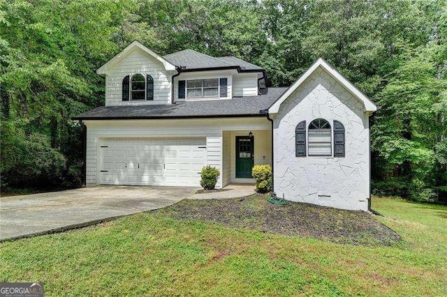 4278 Trotters Ln, Auburn, GA 30011 - view of front of home featuring an attached garage, concrete driveway, a front lawn, and a shingled roof