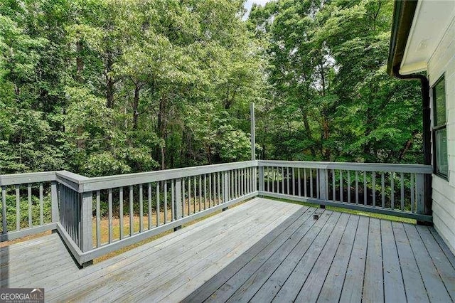 deck with a wooded view