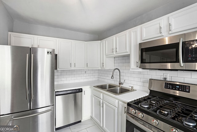 3650 Croft Pl NW, Atlanta, GA 30331 - kitchen with appliances with stainless steel finishes, a sink, white cabinets, and light countertops