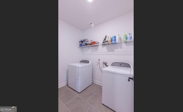 295 Graceton Farms Dr, Senoia, GA 30276 - laundry room with washing machine and clothes dryer, tile patterned floors, and baseboards
